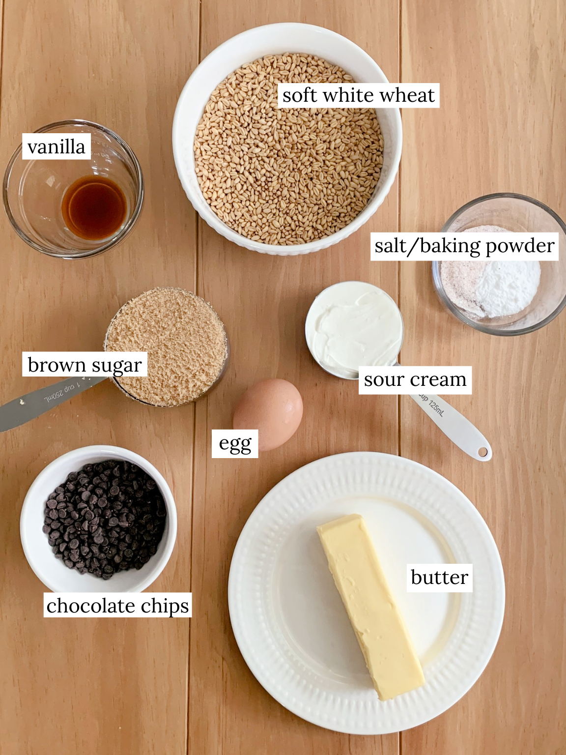 bowls of ingredients for fresh milled chocolate chip cookies on a wooden table